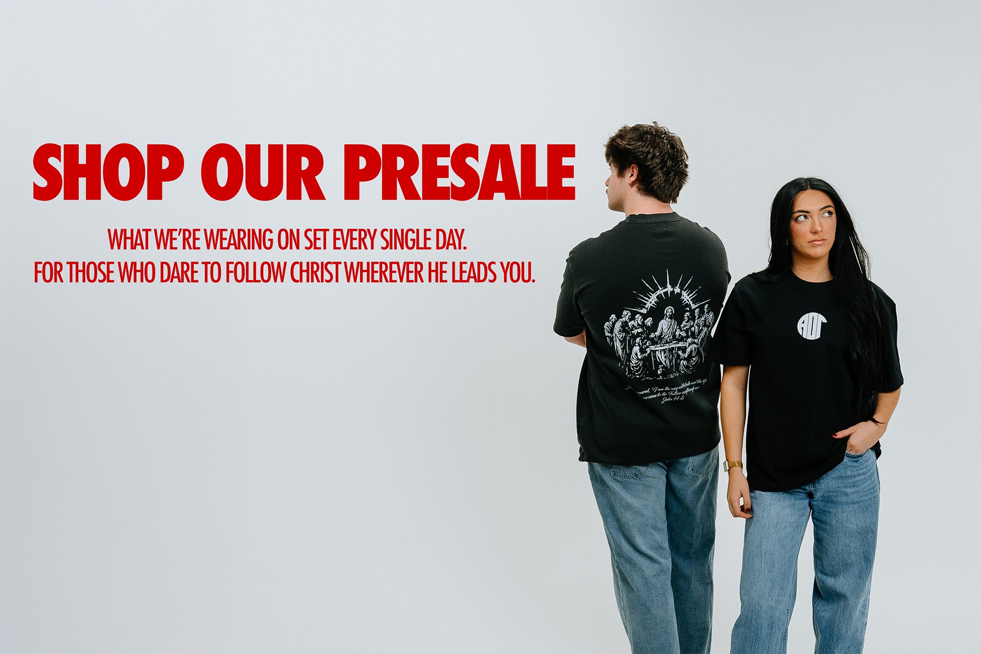 Two people wearing black t-shirts with graphic designs on a gray background, promotional text for a presale.